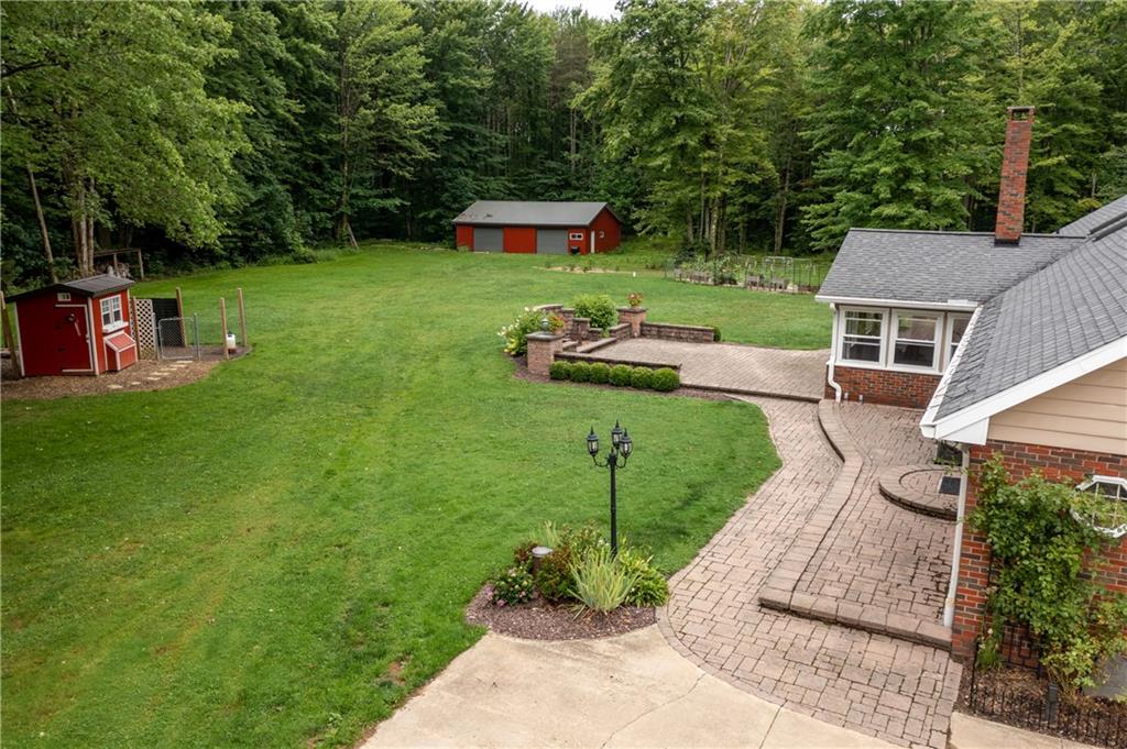 289 Nutt Road Grove City, PA 16127 - Photo 3 of 25 a backyard of a house with seating space