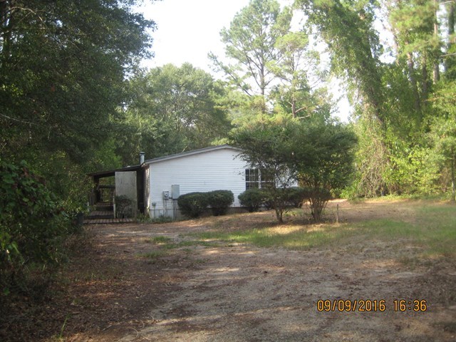 211 Orchard Road Perry, GA 31069 - Photo 1 of 7 a view of a house with a yard