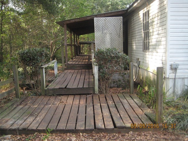 211 Orchard Road Perry, GA 31069 - Photo 2 of 7 a view of backyard with deck