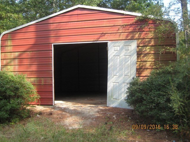 211 Orchard Road Perry, GA 31069 - Photo 4 of 7 a front view of a house with a yard