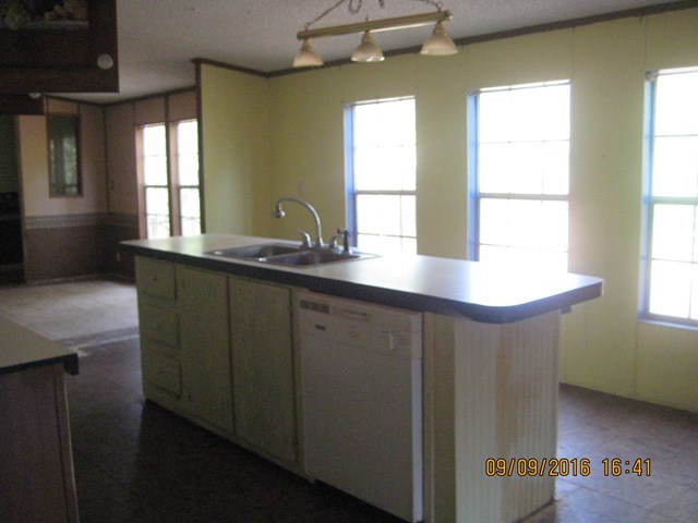 211 Orchard Road Perry, GA 31069 - Photo 5 of 7 a kitchen with a sink and a window