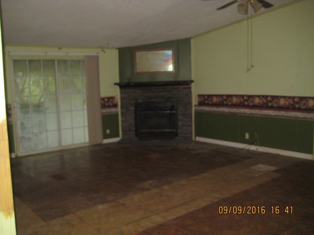 211 Orchard Road Perry, GA 31069 - Photo 6 of 7 a living room with a fireplace