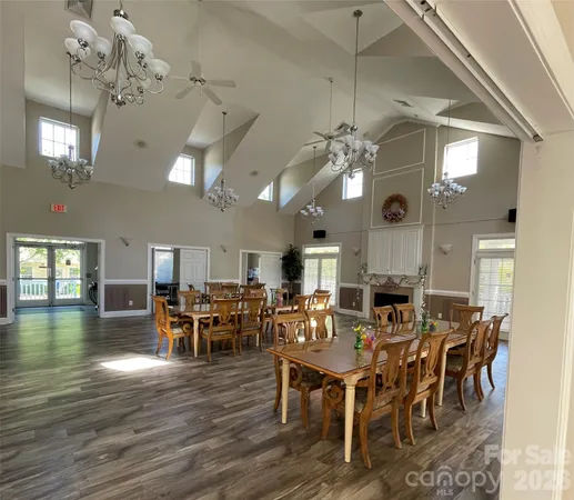 a view of a dining area with furniture and wooden floor