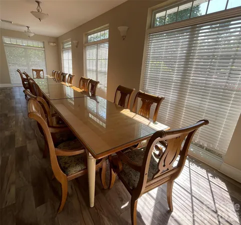 a view of a dining room with furniture and window