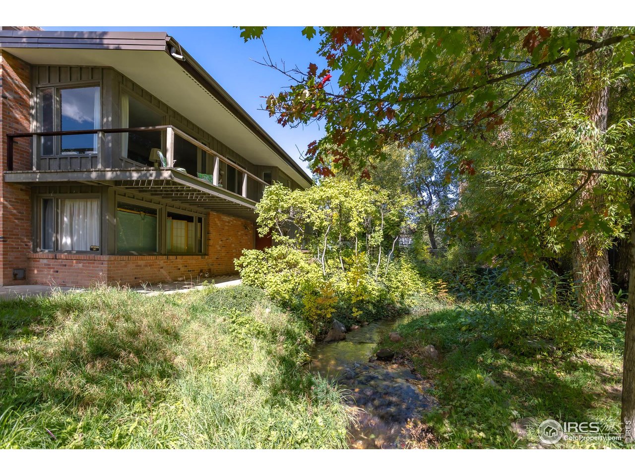 2207 Bluebell Avenue Boulder, CO 80302 - Photo 11 of 47 a front view of a house with a garden