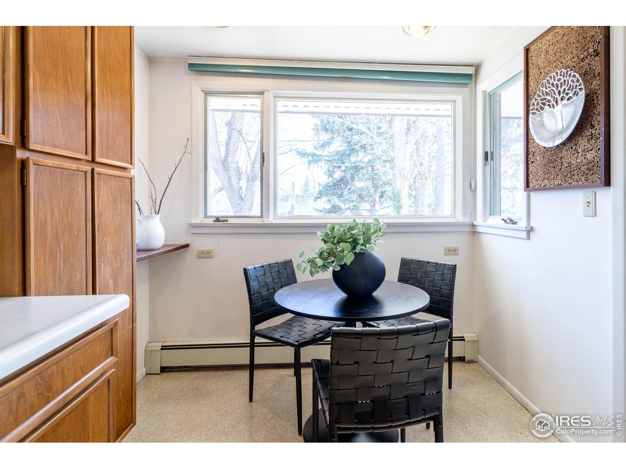 2207 Bluebell Avenue Boulder, CO 80302 - Photo 15 of 47 a kitchen with a table chairs and a refrigerator