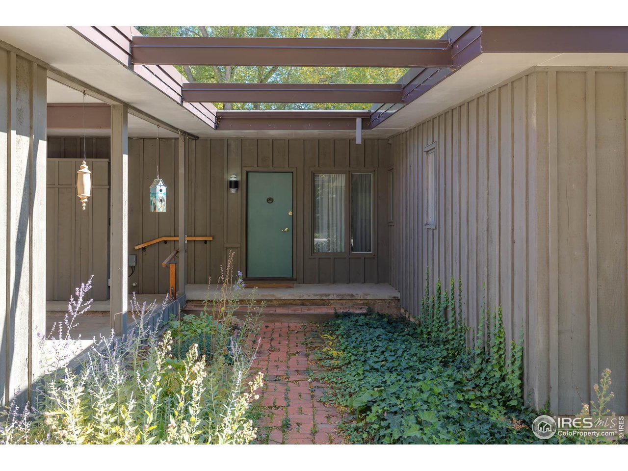 2207 Bluebell Avenue Boulder, CO 80302 - Photo 2 of 47 a front view of a house with a porch