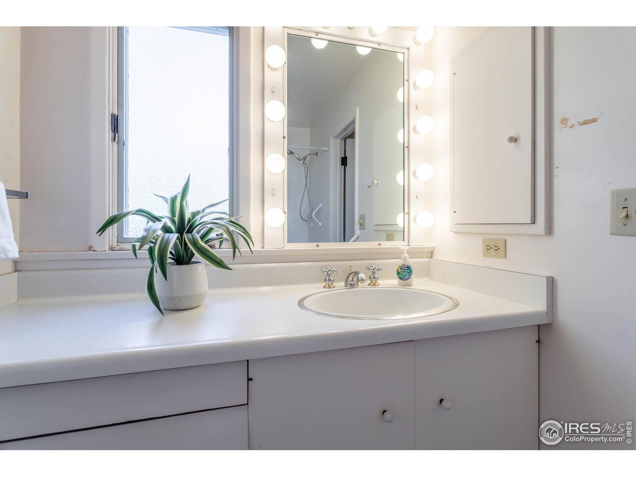 2207 Bluebell Avenue Boulder, CO 80302 - Photo 21 of 47 a bathroom with a sink a vanity and a mirror