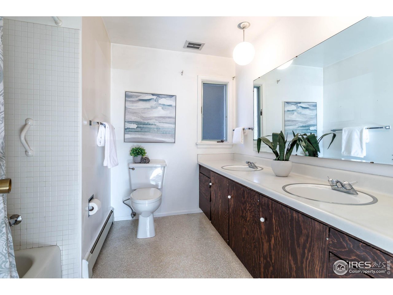 2207 Bluebell Avenue Boulder, CO 80302 - Photo 27 of 47 a bathroom with a granite countertop toilet sink and mirror
