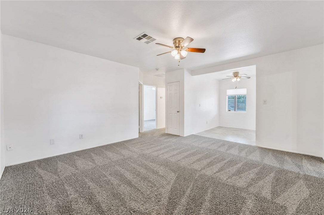 242 Nebraska Avenue Henderson, NV 89015 - Photo 7 of 46 Living room featuring NEW carpet and a ceiling fan