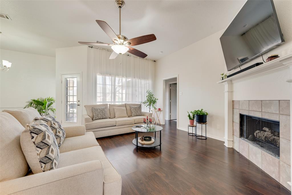 106 Villanova Circle Forney, TX 75126 - Photo 6 of 26 a living room with furniture and a fireplace