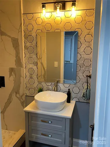 a bathroom with a sink and a mirror