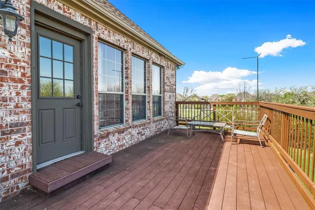 a spacious bedroom with a bed and a ceiling fan
