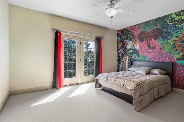 a view of a balcony with wooden floor and iron stairs