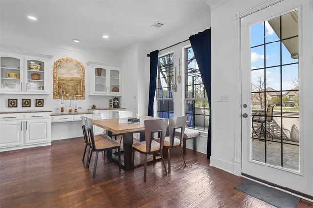 a view of a dining room with furniture and window