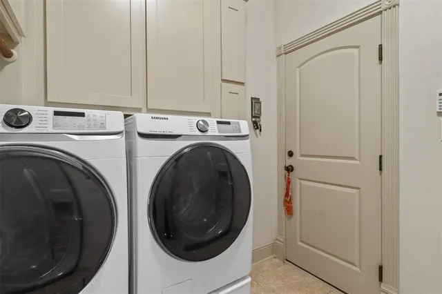 a view of staircase with lots of frames on wall and stairs