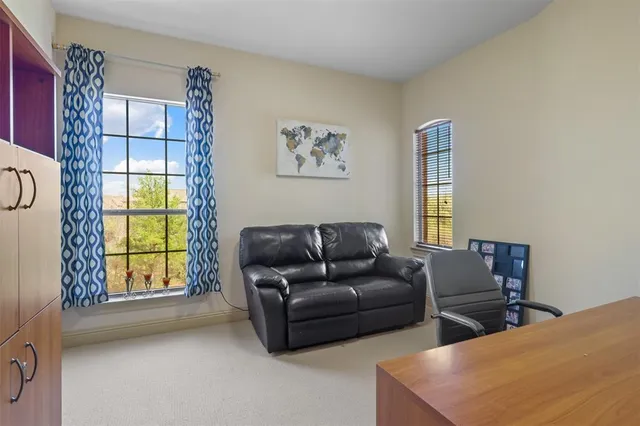 a living room with fireplace furniture and a flat screen tv
