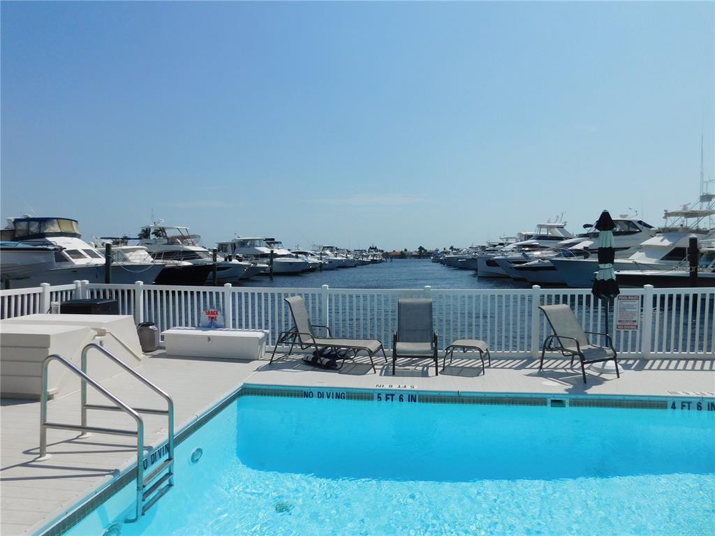 102 Riviera Dunes Way, Unit S7 Palmetto, FL 34221 - Photo 11 of 56 a view of a swimming pool with outdoor seating