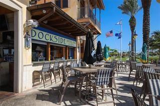 102 Riviera Dunes Way, Unit S7 Palmetto, FL 34221 - Photo 21 of 56 a view of a cafe with sitting area