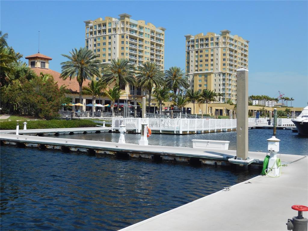 102 Riviera Dunes Way, Unit S7 Palmetto, FL 34221 - Photo 30 of 56 a view of tall buildings and lake view