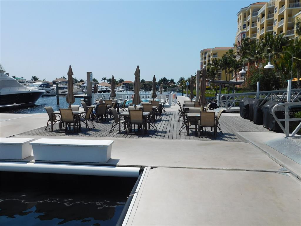 102 Riviera Dunes Way, Unit S7 Palmetto, FL 34221 - Photo 54 of 56 a view of a terrace with furniture and city view