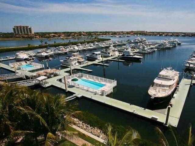 102 Riviera Dunes Way, Unit S7 Palmetto, FL 34221 - Photo 6 of 56 a view of a lake in middle of the town