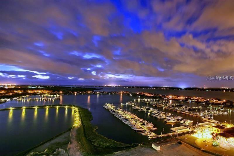 102 Riviera Dunes Way, Unit S7 Palmetto, FL 34221 - Photo 7 of 56 a view of a lake and a city