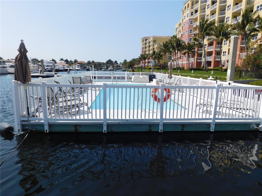 102 Riviera Dunes Way, Unit S7 Palmetto, FL 34221 - Photo 9 of 56 a view of balcony with wooden floor and city view