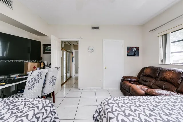 a bedroom with a bed and couch