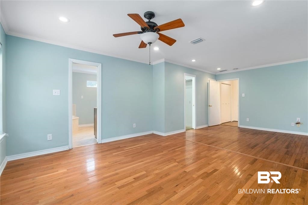 218 Grand Boulevard Mobile, AL 36607 - Photo 6 of 22 Interior space featuring ceiling fan, light hardwood / wood-style flooring, and ornamental molding
