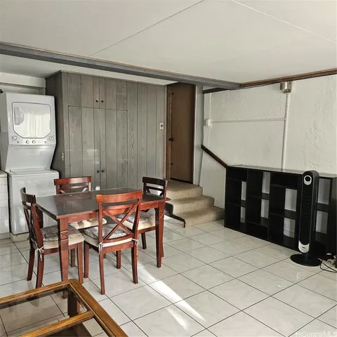 a view of a dining room with furniture and window
