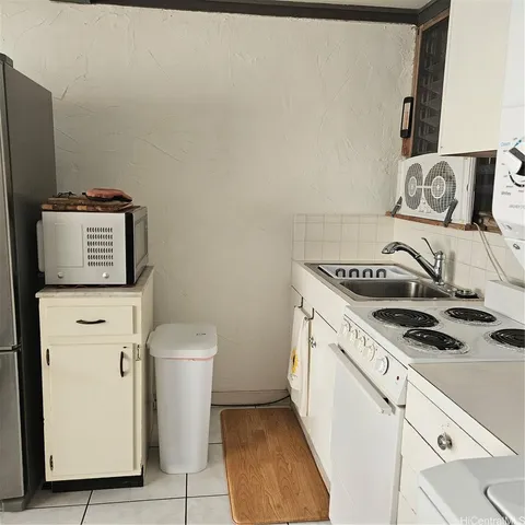 a kitchen with a stove and a microwave