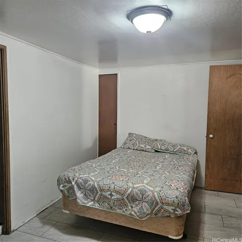 a bedroom with a bed and a table