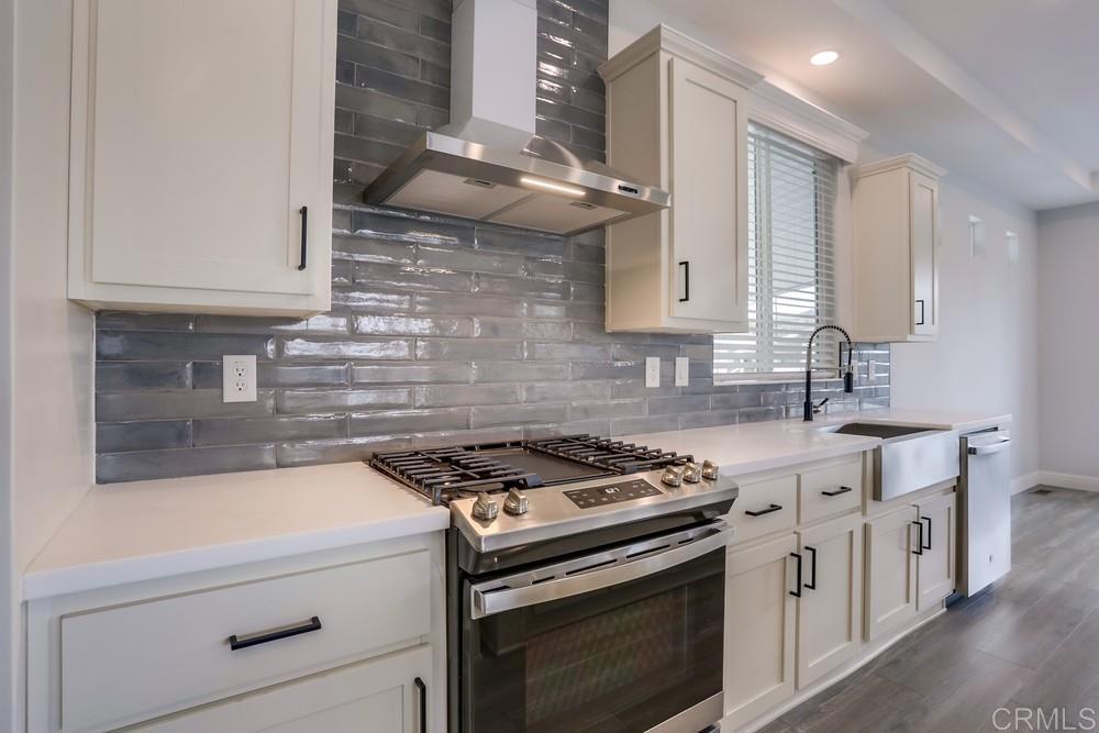 4650 Dulin Road, Unit 45 Fallbrook, CA 92003 - Photo 17 of 42 a kitchen with stainless steel appliances granite countertop a stove and a sink