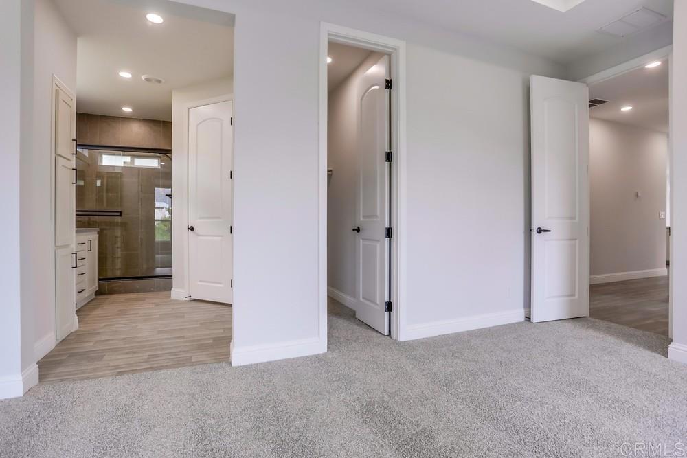 4650 Dulin Road, Unit 45 Fallbrook, CA 92003 - Photo 20 of 42 an empty room with closet and a bathroom