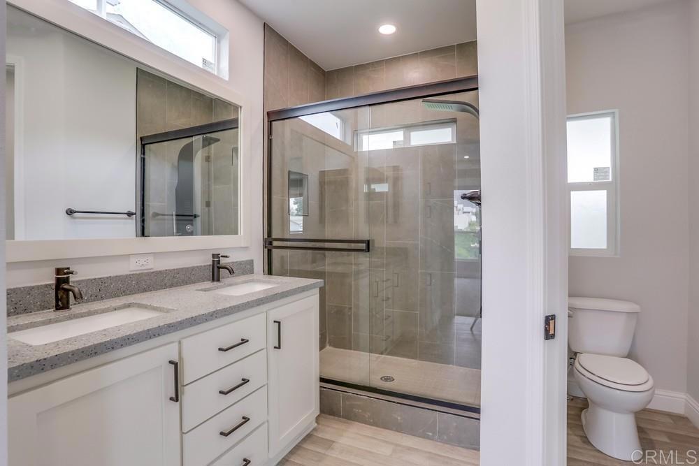 4650 Dulin Road, Unit 45 Fallbrook, CA 92003 - Photo 21 of 42 a bathroom with a granite countertop sink toilet and shower