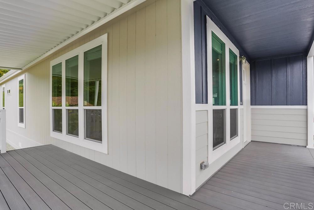 4650 Dulin Road, Unit 45 Fallbrook, CA 92003 - Photo 32 of 42 a view of a porch with wooden floor and fence