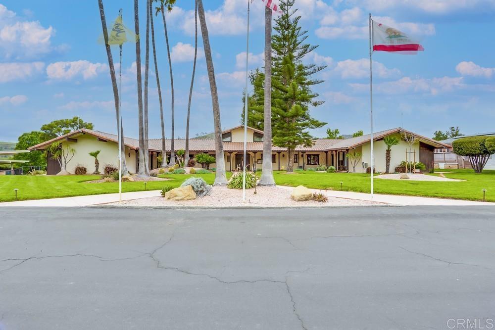 4650 Dulin Road, Unit 45 Fallbrook, CA 92003 - Photo 35 of 42 a view of a house with a garden and plants