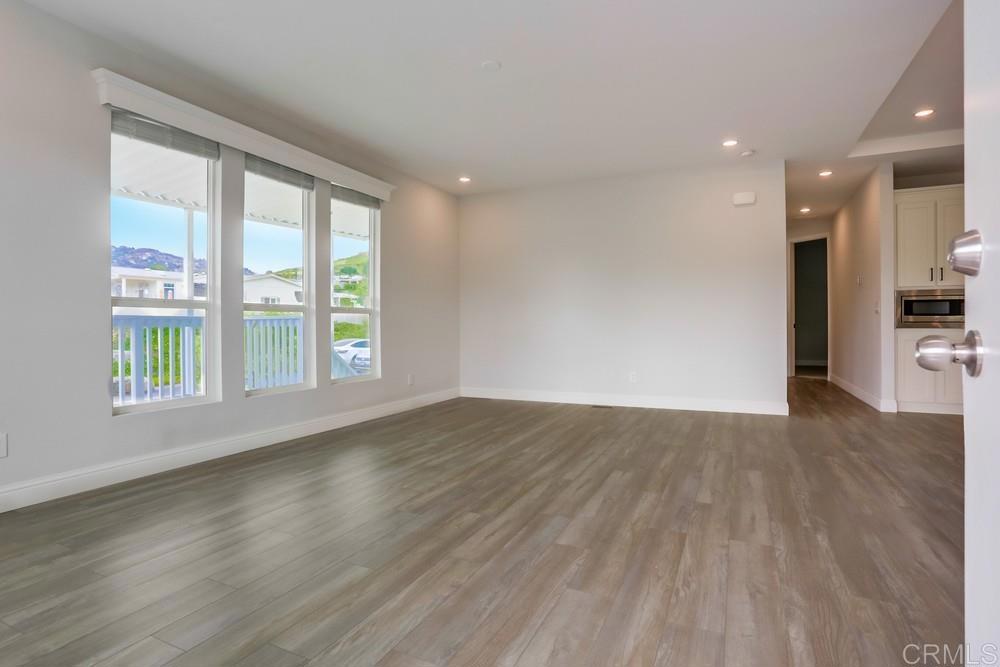 4650 Dulin Road, Unit 45 Fallbrook, CA 92003 - Photo 5 of 42 wooden floor in an empty room with a window