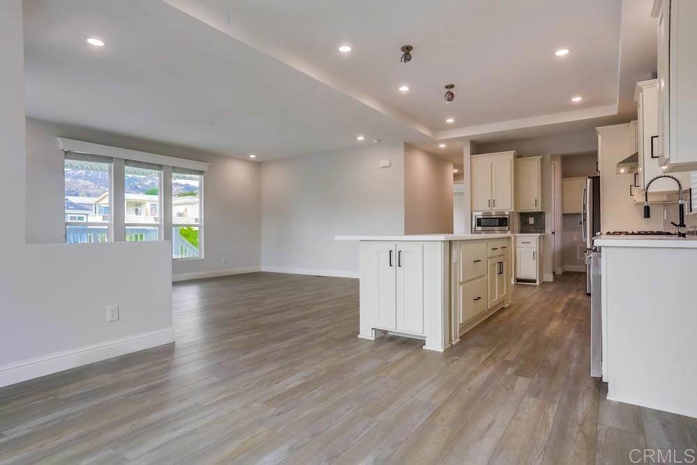 4650 Dulin Road, Unit 45 Fallbrook, CA 92003 - Photo 10 of 42 a view of kitchen with furniture and wooden floor