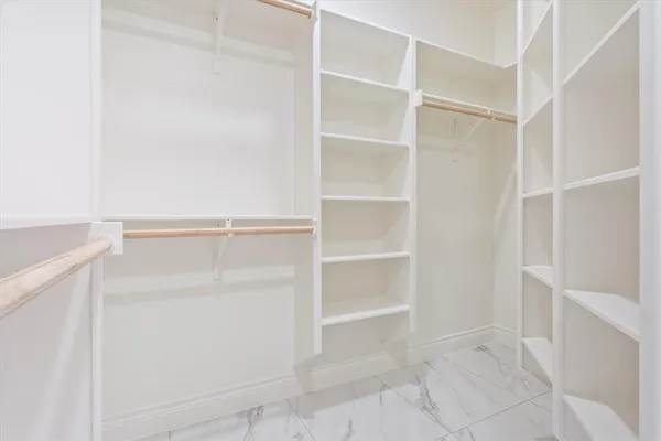 a view of an empty walk in closet