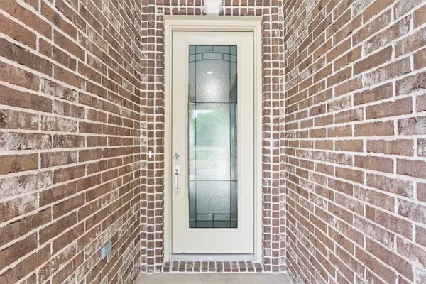 a bathroom with a shower and a mirror
