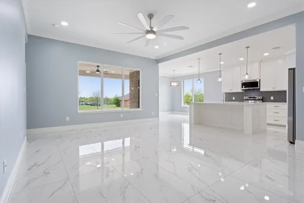 a view of kitchen with furniture and window