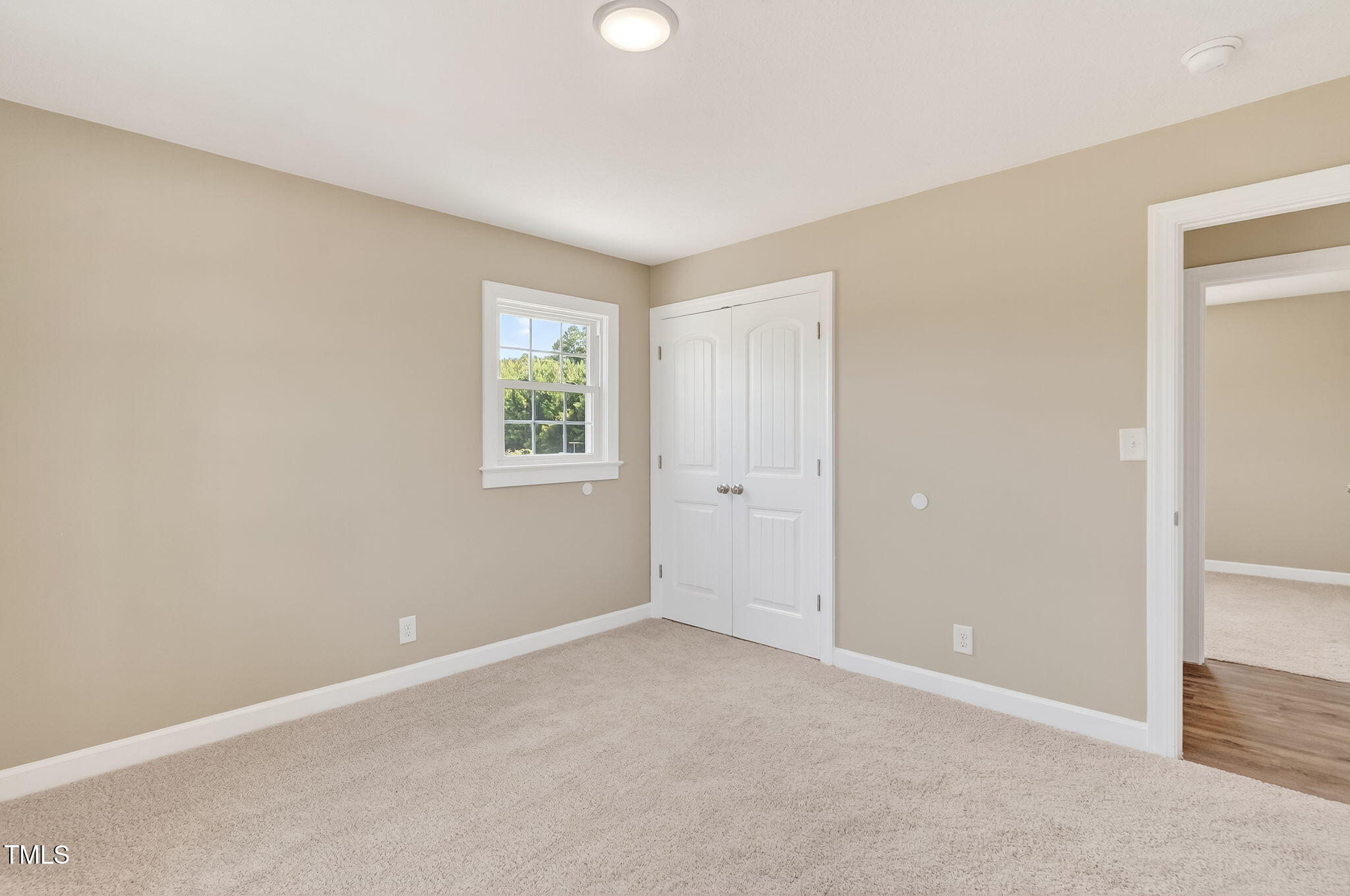 6715 Princeton Kenly Road Princeton, NC 27569 - Photo 11 of 35 an empty room with windows and closet