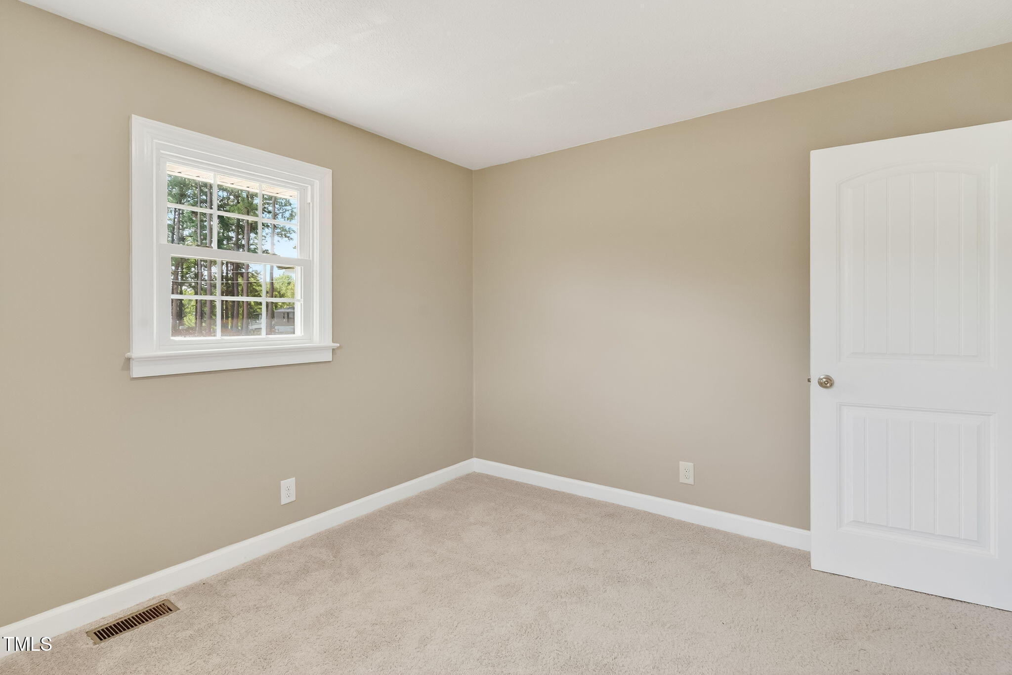 6715 Princeton Kenly Road Princeton, NC 27569 - Photo 14 of 35 an empty room with a window