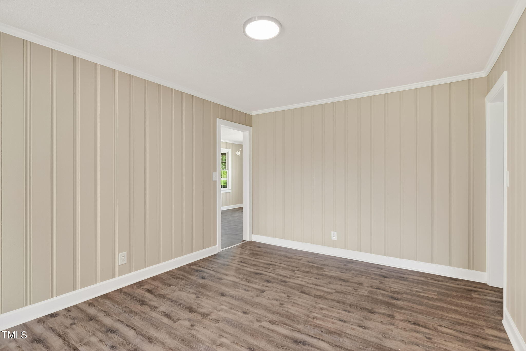 6715 Princeton Kenly Road Princeton, NC 27569 - Photo 19 of 35 a view of an empty room with wooden floor