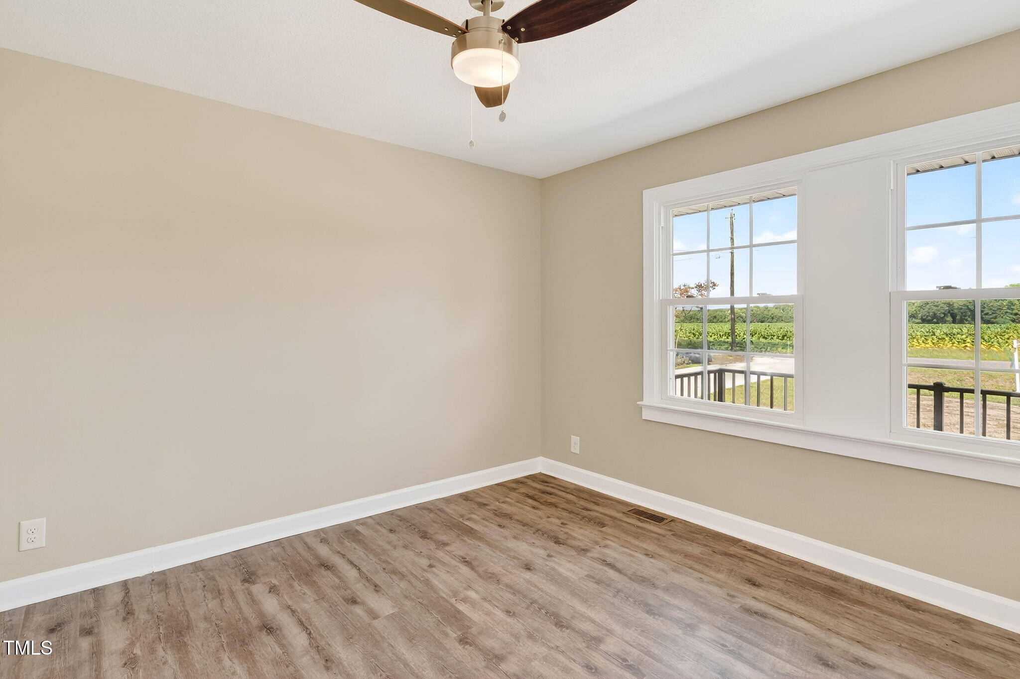 6715 Princeton Kenly Road Princeton, NC 27569 - Photo 7 of 35 an empty room with a window