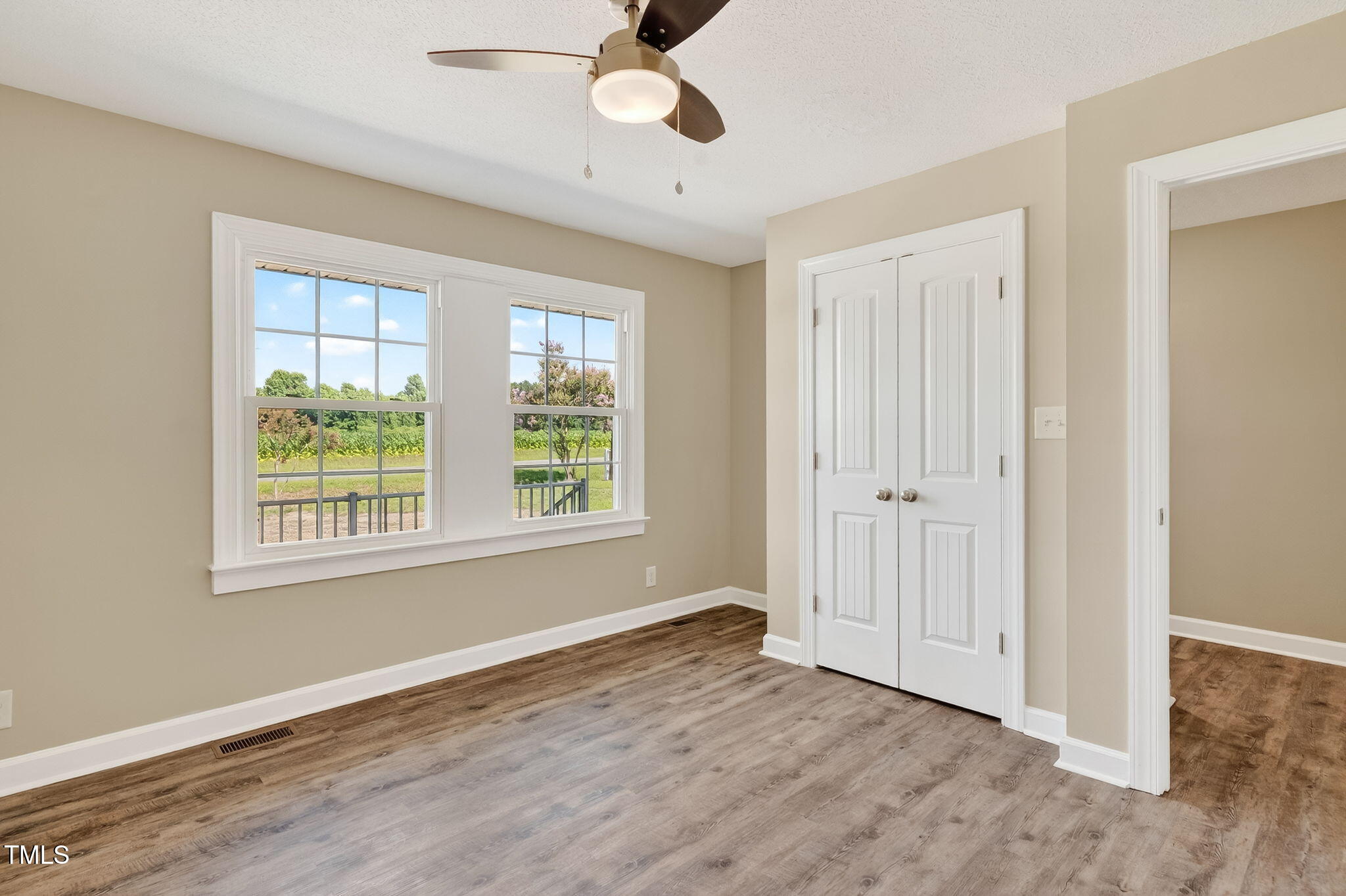 6715 Princeton Kenly Road Princeton, NC 27569 - Photo 8 of 35 a view of an empty room with a window