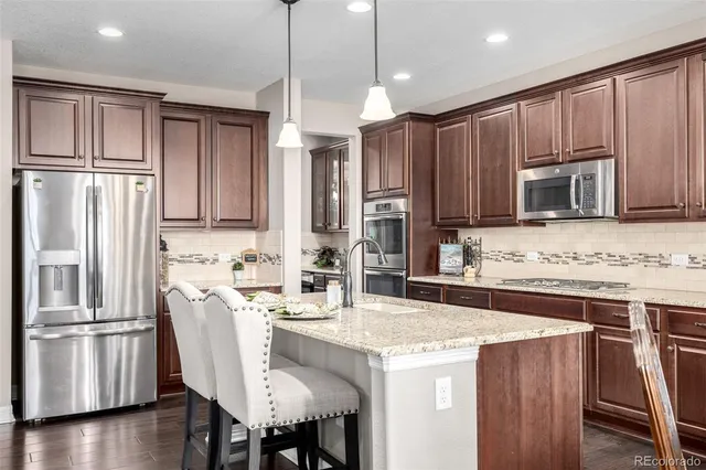 a view of a dining room with furniture and window