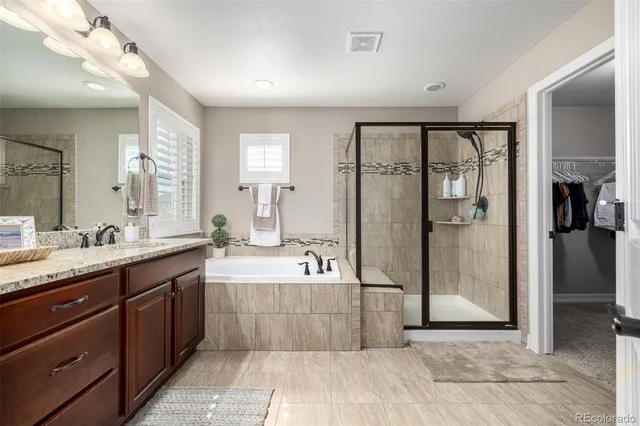 a view of a livingroom with furniture and a flat screen tv